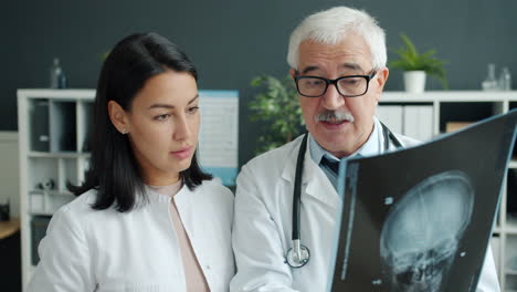 doctors reviewing a patient's x-ray