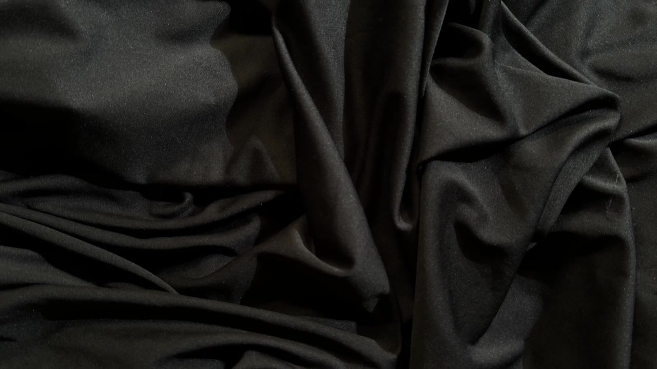 Close-up of Soft Black Fabric with Elegant Folds