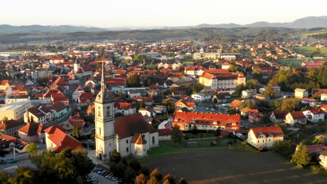 aerial panorama view of small medieval european town slovenska bistrica, slovenia with church and castle in sunrise