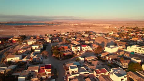 Aerial-establishing-shot-of-Coquimbo-and-Bahia-Inglesa-beach-at-sunset-in-Chile