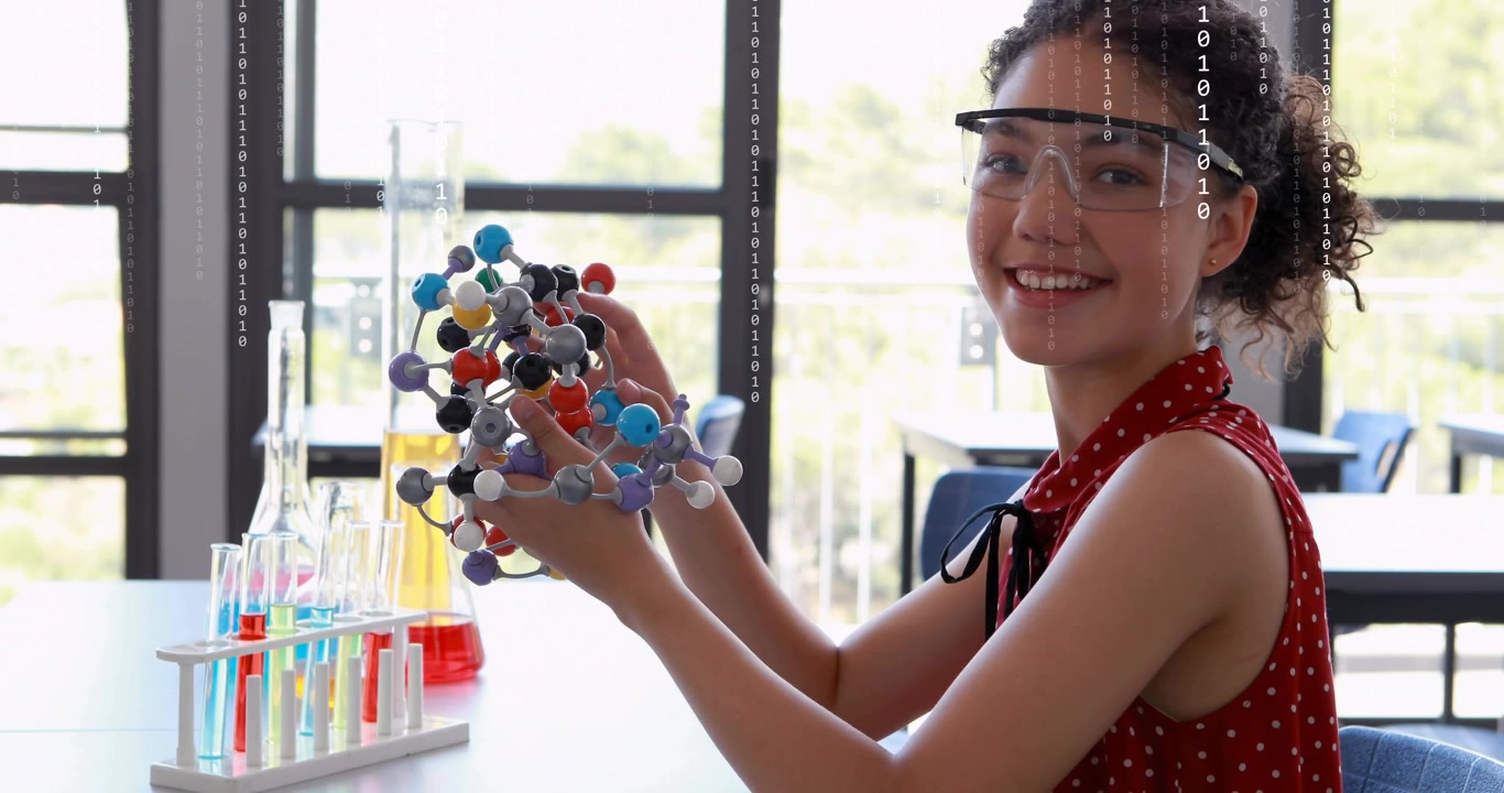 Estudante pegando um modelo molecular, girando esferas e inspecionando ligações para mostrar a estrutura para o laboratório.