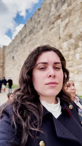 woman enjoying sunshine in jerusalem plaza