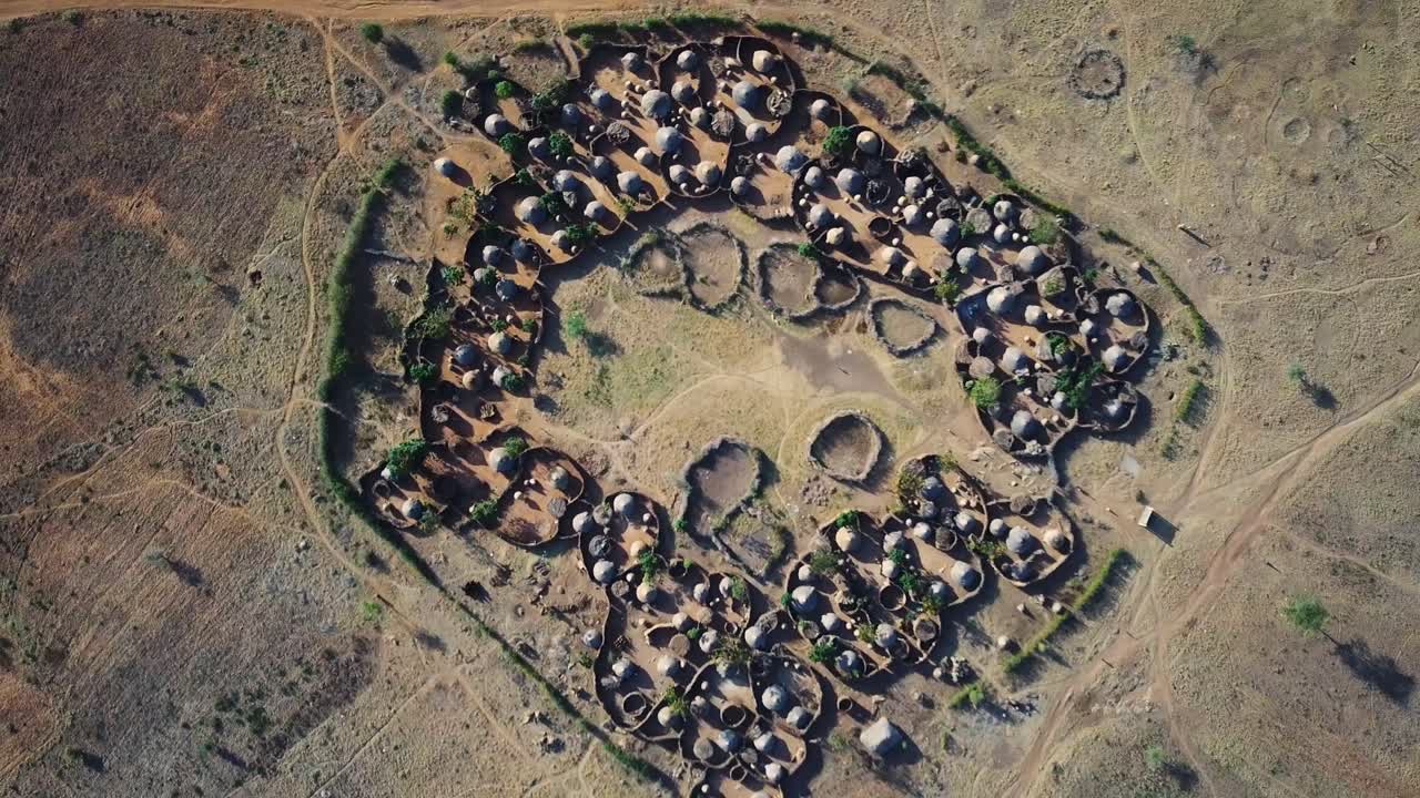 Drone view from above the center of a village in the Karamoja region, also called Manyatta or Ere, in Uganda, during a sunny day