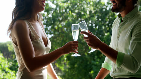 romantic couple toasting champagne glasses