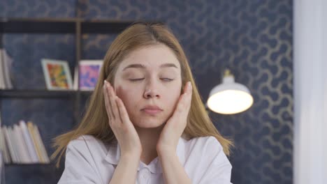 stressed business woman with hands on face.