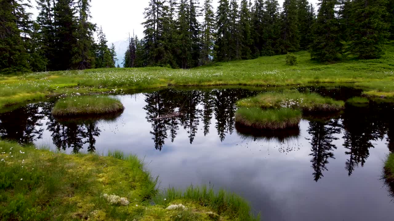 Slow drone ride over idyllic mountain lake in the alps in tyrol, austria