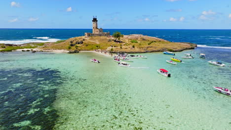 Aerial-drone-view-of-a-lighthouse-on-Ile-aux-Fouquets,-Ile-au-Phare,-Bois-des-Amourettes,-Mauritius