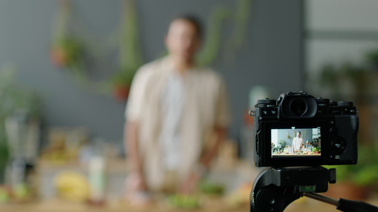 Camera Recording Male Food Blogger in Kitchen