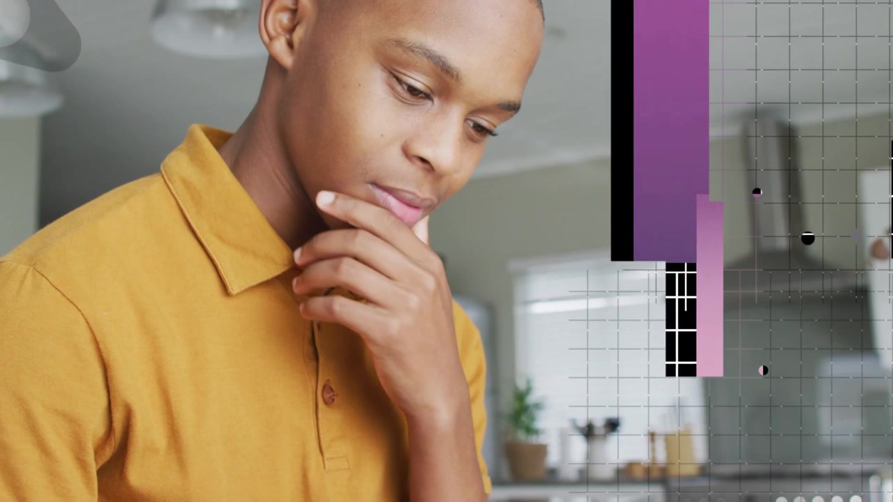 Male teenager scrolling device in kitchen, generating purple overlays and analyzing tech content