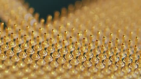 Detail-view-of-the-golden-pins-of-a-CPU:-gaming-PC-component-macro-shot,-close-up-view