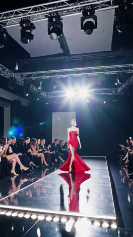 fashion model in red dress on runway