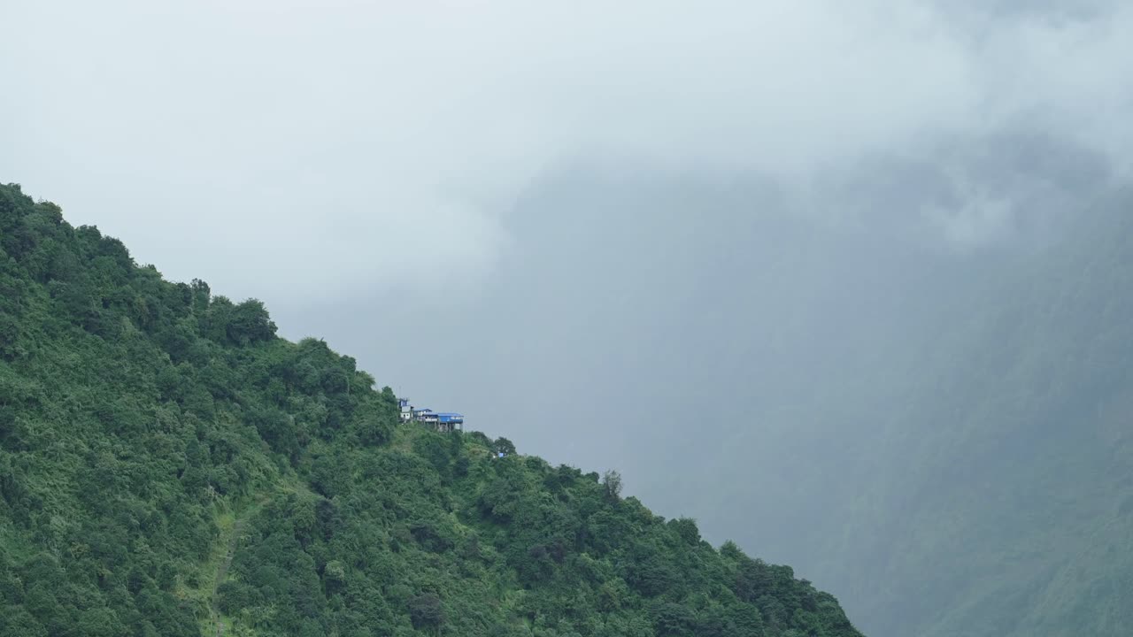 Nepal Himalayas Remote Trekking Village in Annapurna Mountains on Annapurna Circuit Trek, Mountain Scenery and Remote Village with Buildings and Teahouses in Beautiful Green Landscape