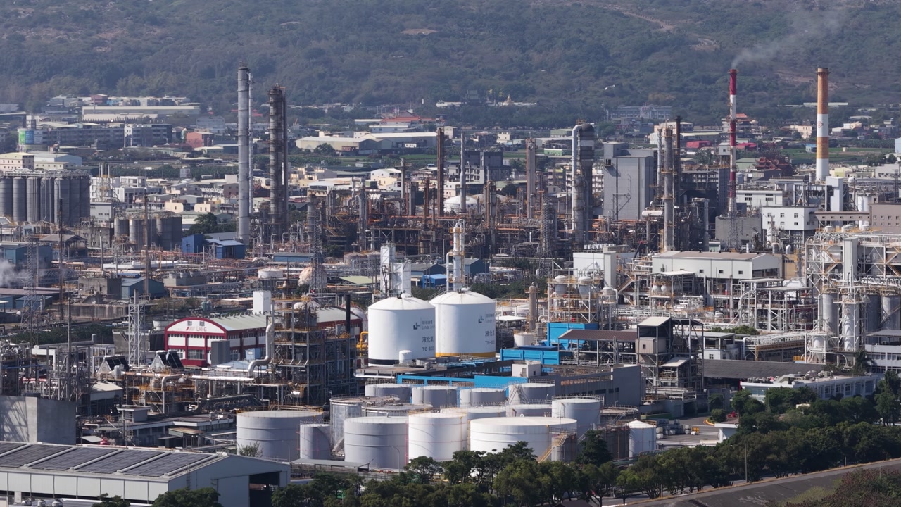 Aerial close up drone video of plastic manufacturing and chemical industry in Mueang Rayong District, Thailand, showing industrial production, petrochemical infrastructure, and factory operations.