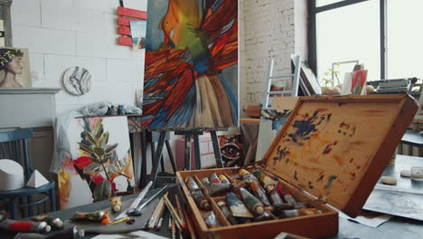 artist's studio with colorful paintings