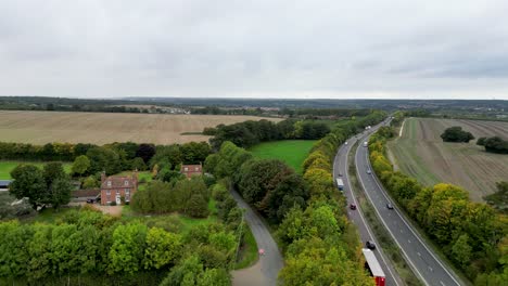 a country road with a country house in