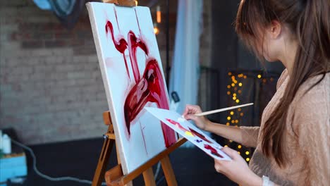 woman painting abstract art