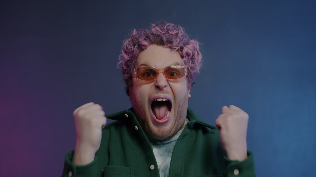 Excited Man with Pink Hair and Sunglasses