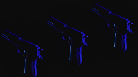 pistols on the dark background and in blinking red and blue light rotate in slowmotion