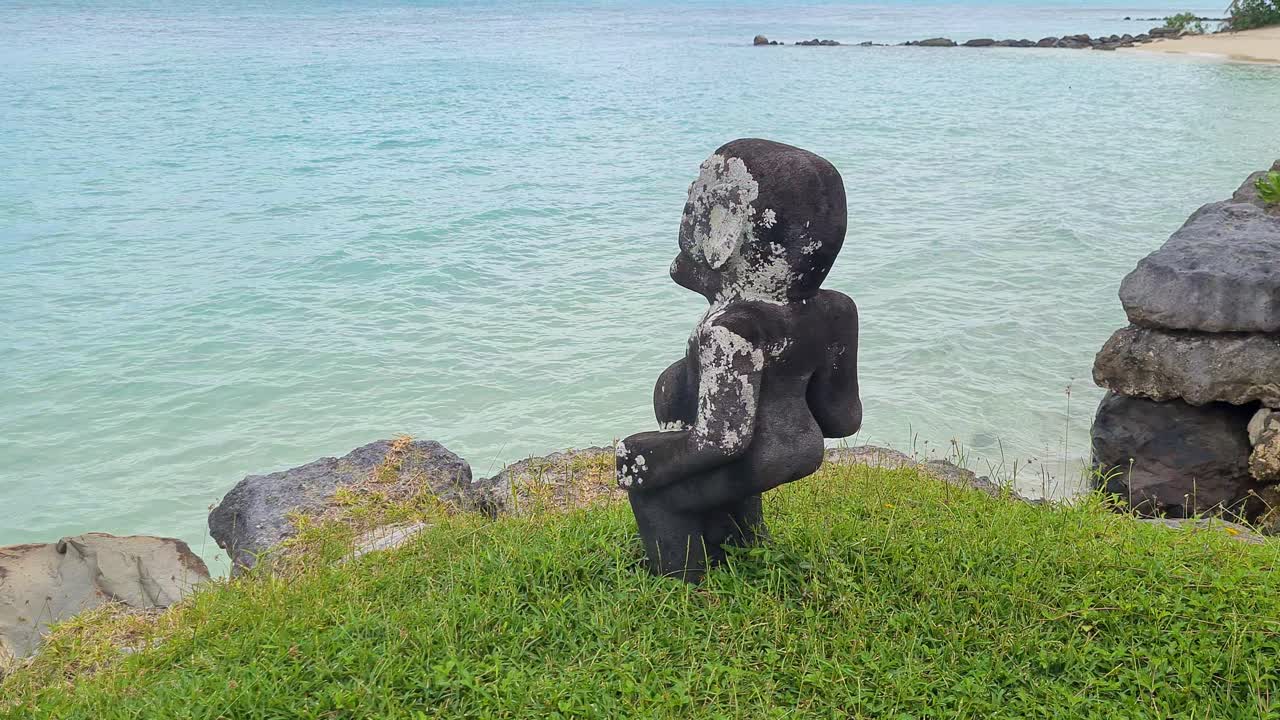 French Polynesia. Ancient Anini Mara'e Ceremonial Site and Stone Sculptures by Coast
