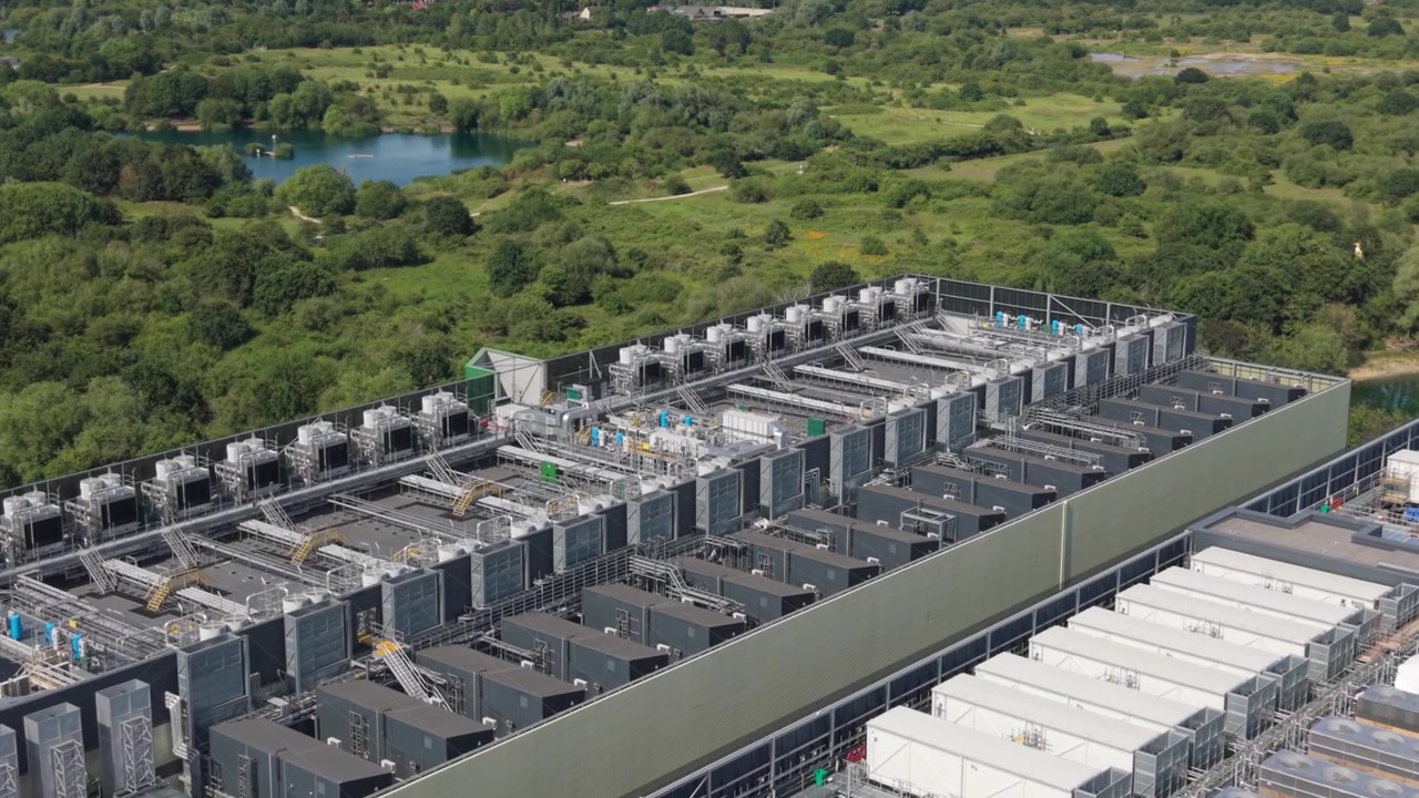 Expansive aerial view shows a modern data center facility.