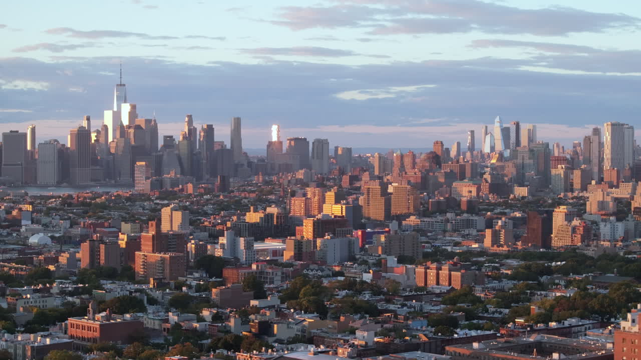 Drone shot of Brooklyn and Manhattan at sunset.