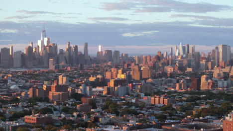 drone shot of brooklyn and manhattan at sunset.