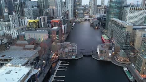 london uk millwall dock , canary wharf drone reveal at dusk