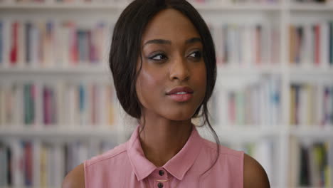 portrait-confident-african-american-woman-smiling-flirty-beautiful-black-female-student-wearing-stylish-fashion-in-library-bookshelf-background