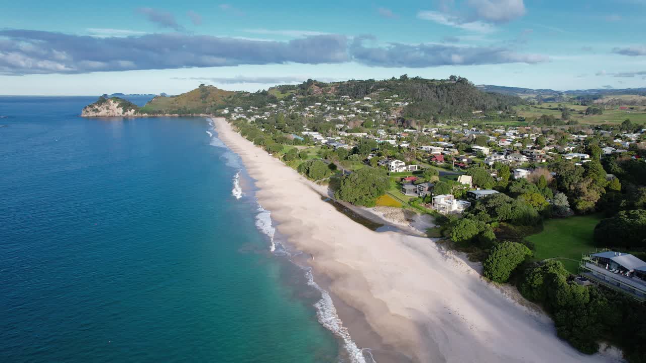 Aerial view of a picturesque coastal town and beach
