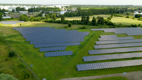 New-Solar-Panels-In-Photovoltaic-Power-Plant,-Gdansk,-Poland---aerial-shot