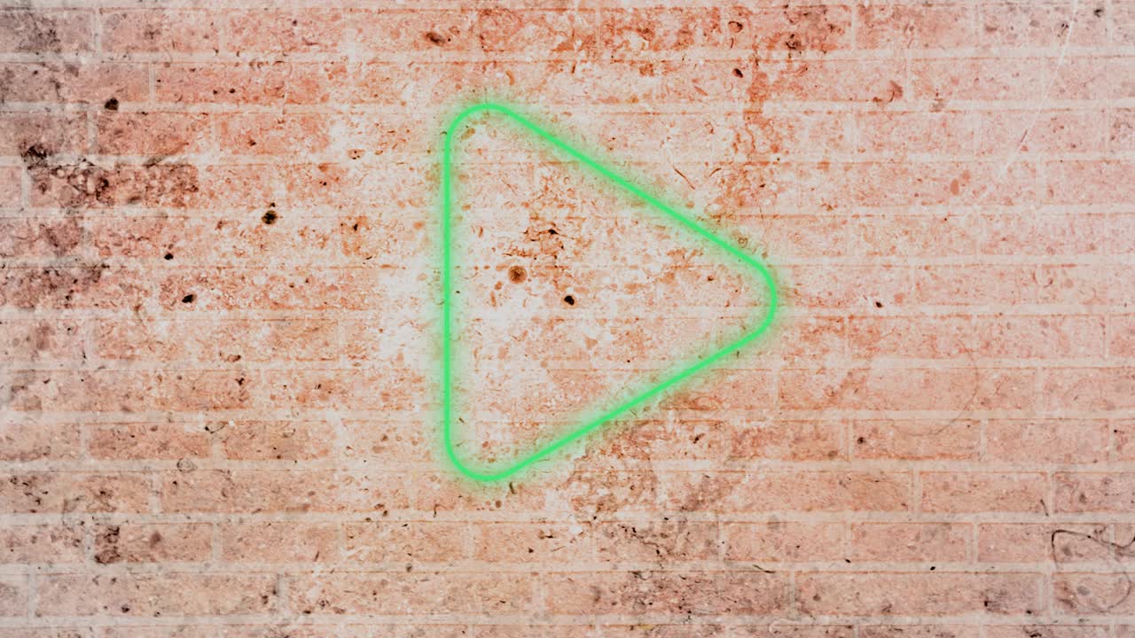 animación de un icono de juego de neón parpadeante en la pared de ladrillo