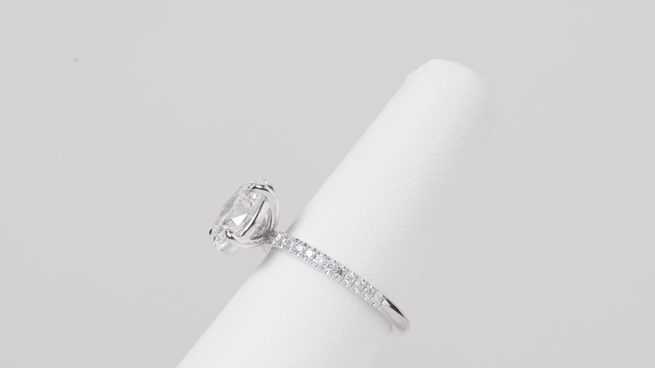 Close-up of an elegant diamond ring rotating on a jewelry stand, perfect for luxury, fashion, or product showcase visuals