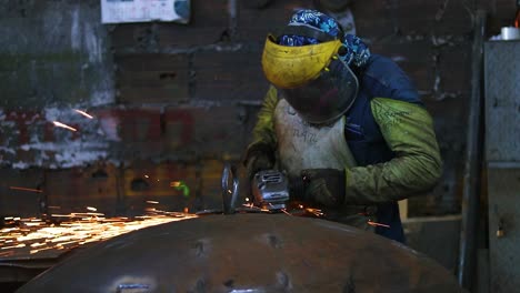 worker polishing in metal industry