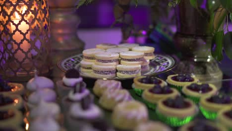 event table with a variety of desserts, including cupcakes and cookies