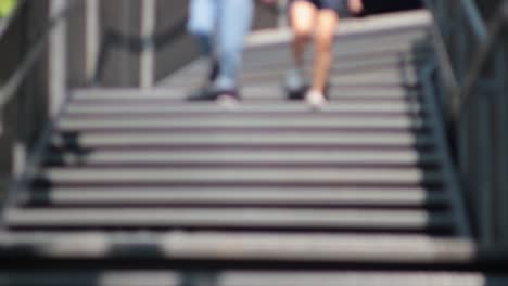 two people walking down stairs side by side