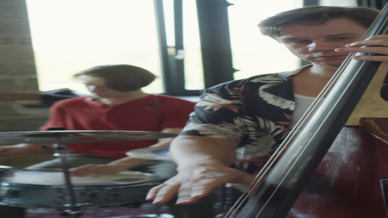 Band Instrumentalists Playing Double Bass and Drums