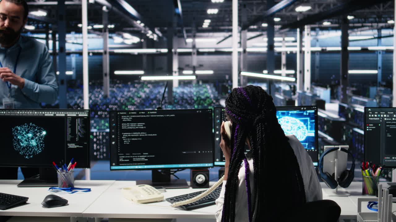 Engineer In Data Center Answers Telephone Call, Assisting Users With Ai