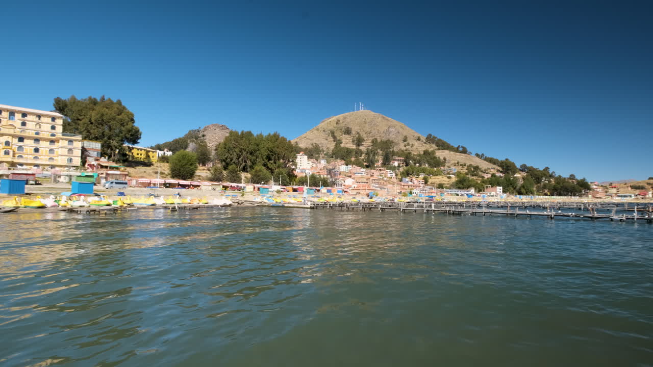 Discover the serene beach of Copacabana, Bolivia, nestled on the shores of Lake Titicaca