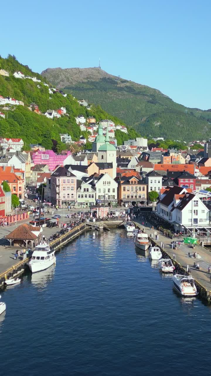 Summer aerial view of Bryggen, the historic harbour district in Bergen, Norway, captured from a striking Vertical perspective.