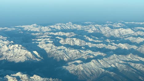 aerial view of the pyrenees mountains at the golden minute after sunset, pilot point of view