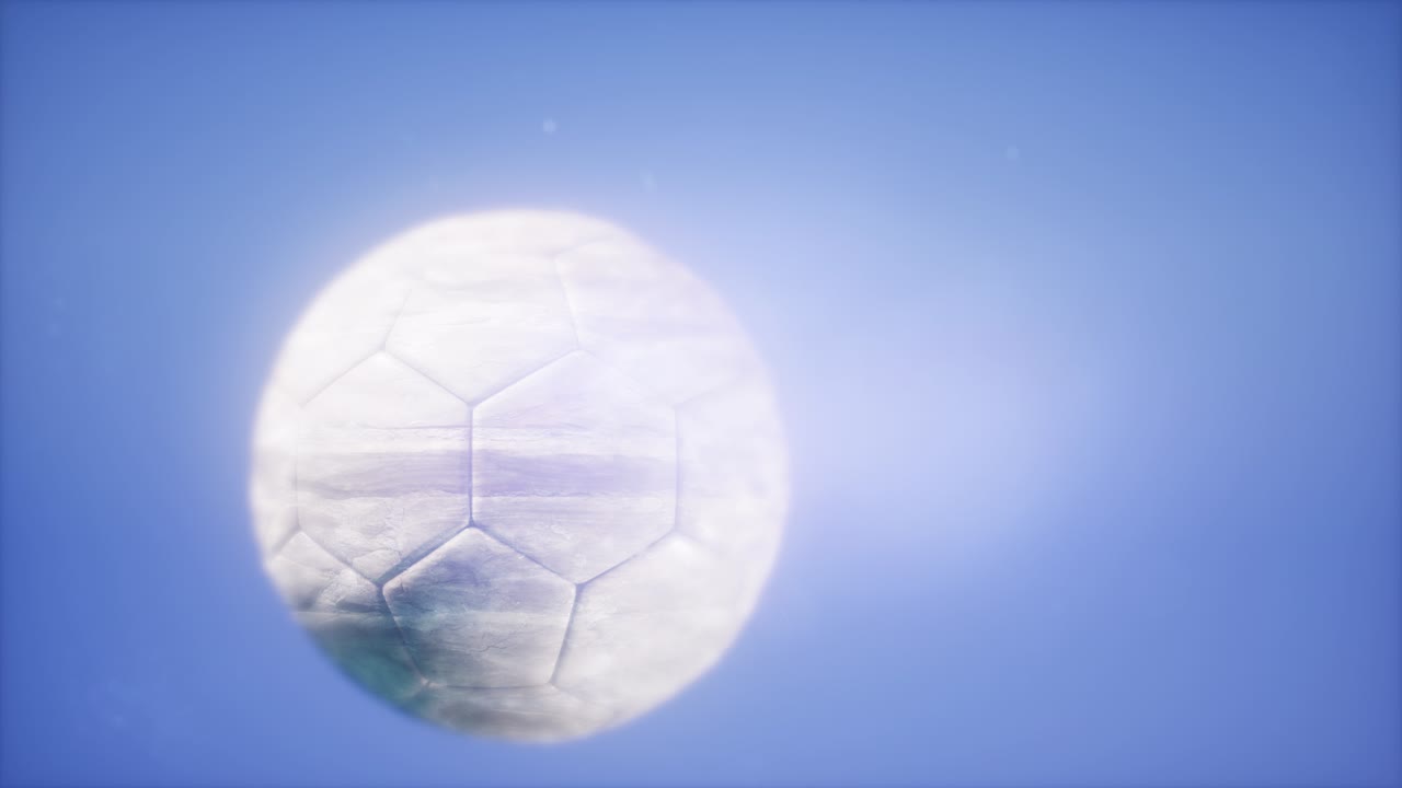 青空を背景にしたサッカーボール