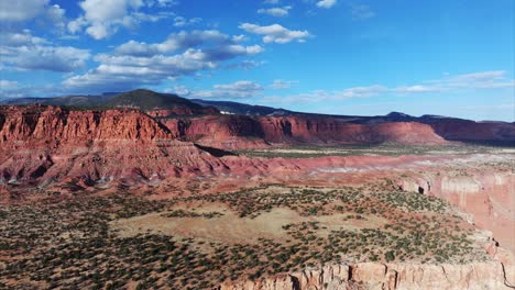 capitol reef mountains against blue sky, aerial view of utah national park