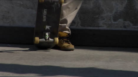 several skateboarders skate around and flip their boards