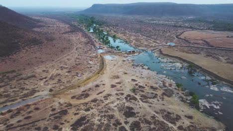 Aerial-Drone-shot-of-a-small-River-in-Forests-of-Gwalior