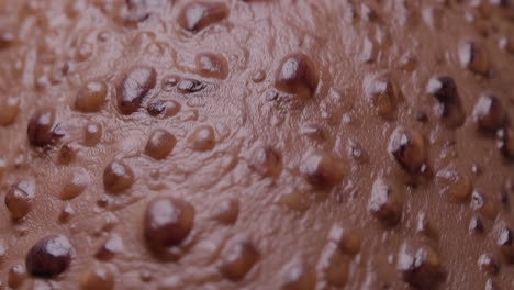 close-up of water droplets on textured surface