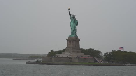 view of statue of liberty from staten island ferry on rainy day