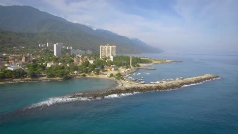 Drone-shot-view-of-the-breakwater-coastline-in-the-calm-Caribbean-Sea