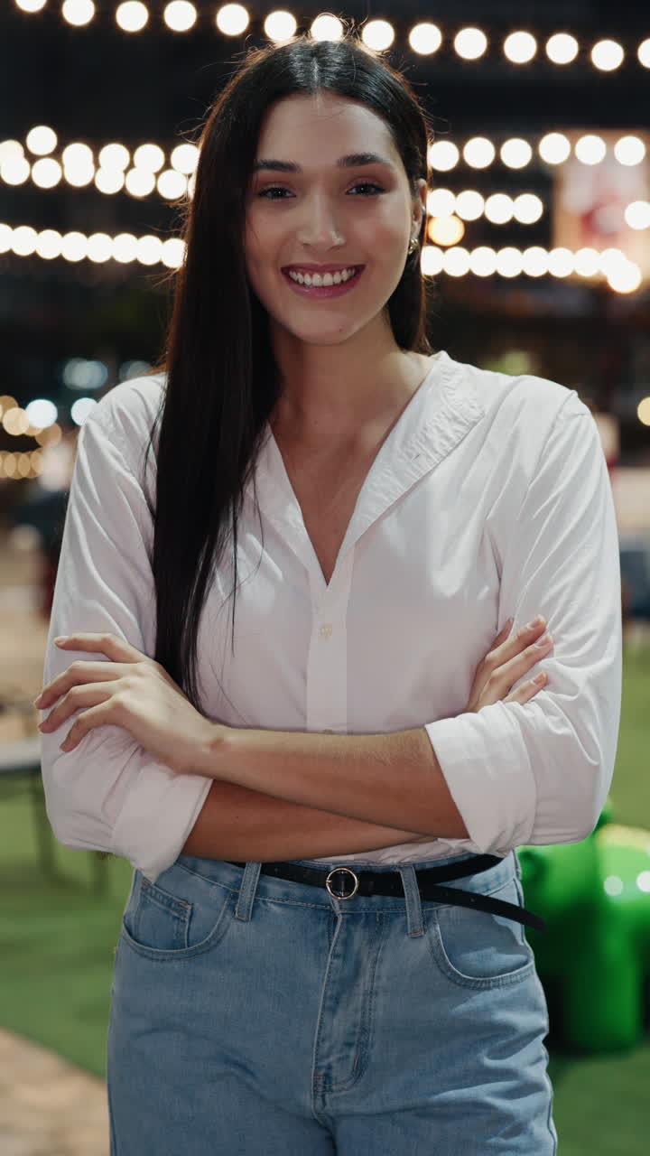 Smiling Woman in a White Shirt and Jeans