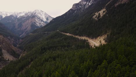 aerial drone shot of winding road near duffey lake in british columbia