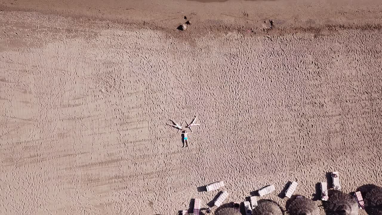 People Sunbathing on Beach - Aerial View